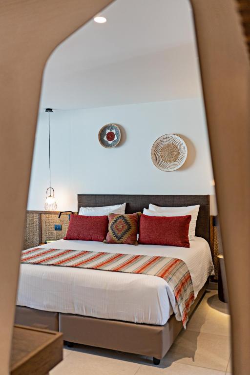 Postel nebo postele na pokoji v ubytování Minos Ambassador Suites & Spa - Adults only