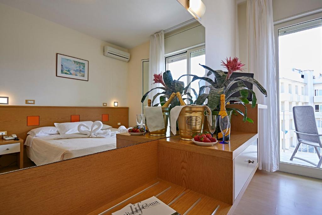 Postel nebo postele na pokoji v ubytování Hotel Ridolfi
