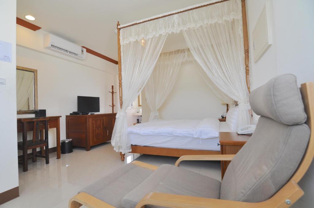 Postel nebo postele na pokoji v ubytování Xinghai Seaview Guesthouse