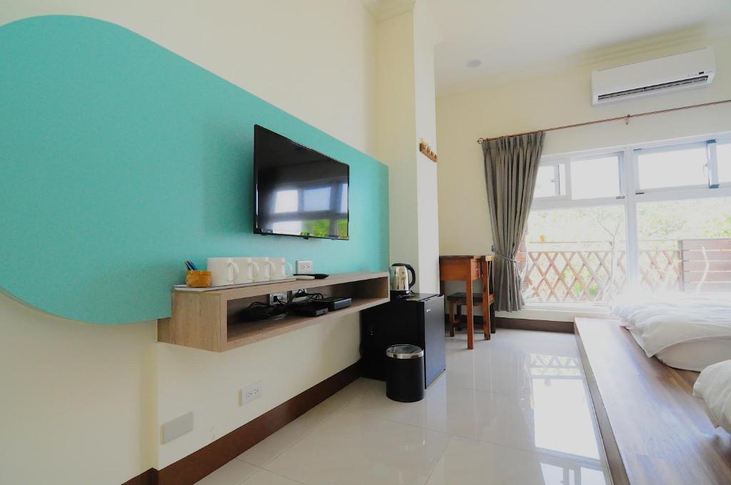 TV a/nebo společenská místnost v ubytování Xinghai Seaview Guesthouse
