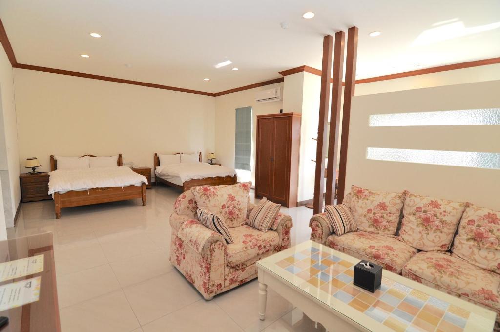 Postel nebo postele na pokoji v ubytování Xinghai Seaview Guesthouse