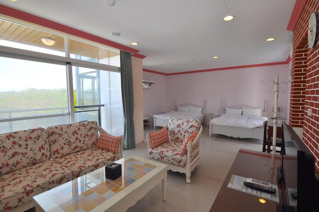 Postel nebo postele na pokoji v ubytování Xinghai Seaview Guesthouse