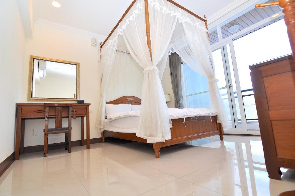Postel nebo postele na pokoji v ubytování Xinghai Seaview Guesthouse