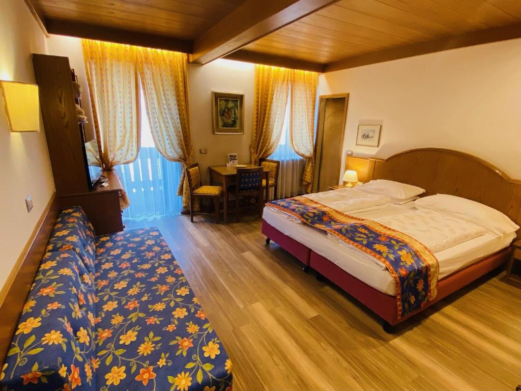 Postel nebo postele na pokoji v ubytování Active Hotel Ancora