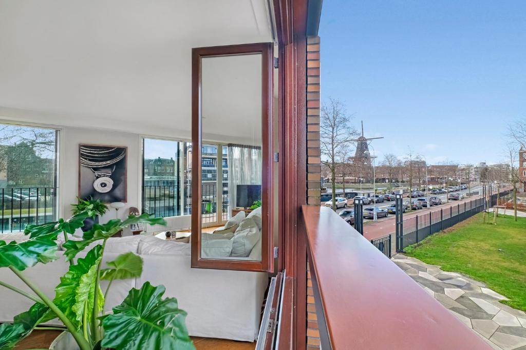 a balcony with a view of a parking lot at 170M2 Appartment with Jacuzzi & Steam bath in center of Amsterdam in Amsterdam