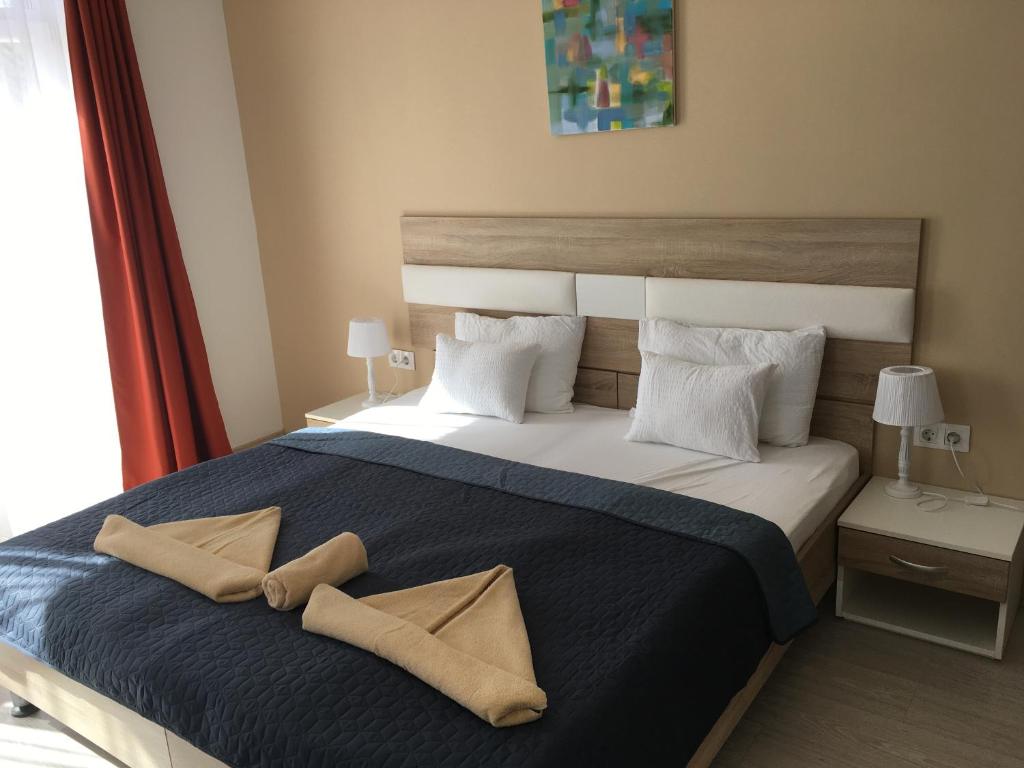Postel nebo postele na pokoji v ubytování Hotel Pallone