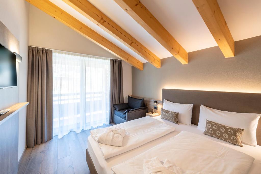 Postel nebo postele na pokoji v ubytování Chalet Aster