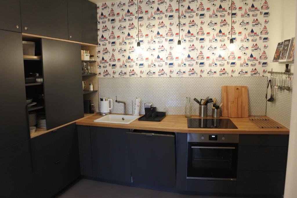 Kuchyň nebo kuchyňský kout v ubytování Apartmán SVAN B2