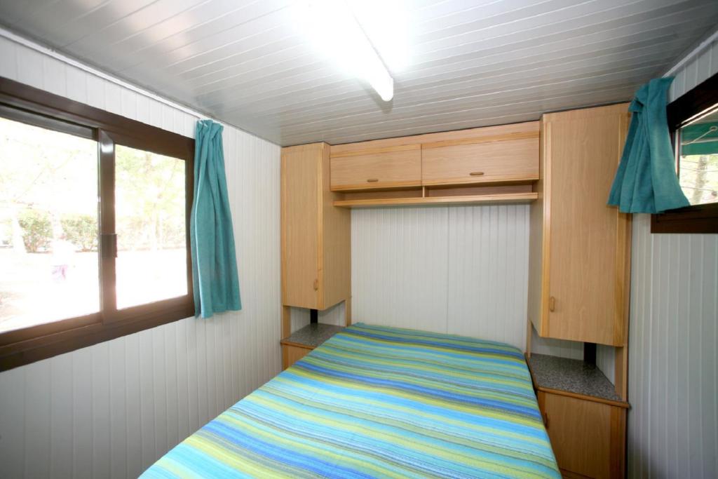 Postel nebo postele na pokoji v ubytování Camping La Gemma