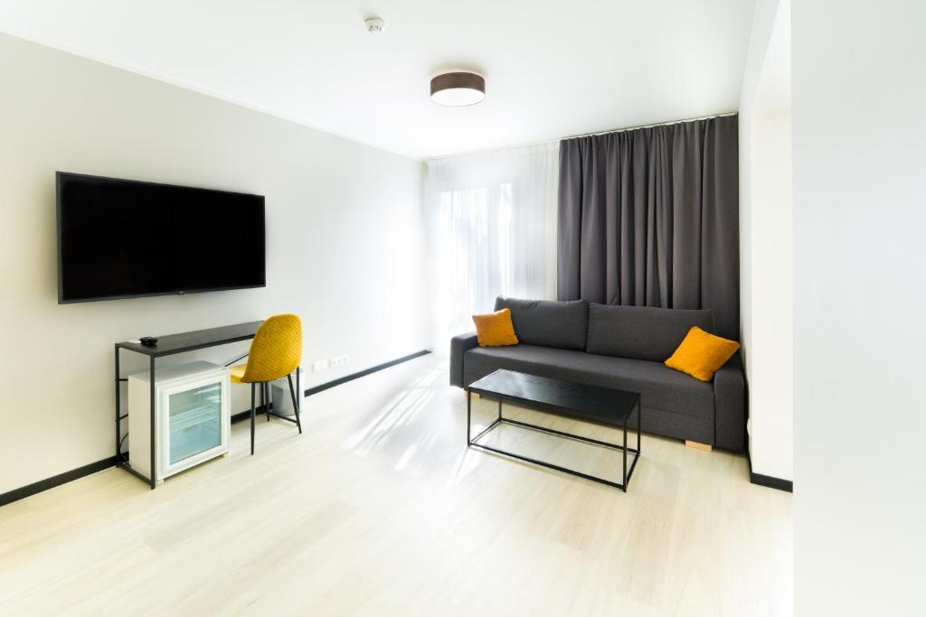 TV a/nebo společenská místnost v ubytování Hotel NOSPA