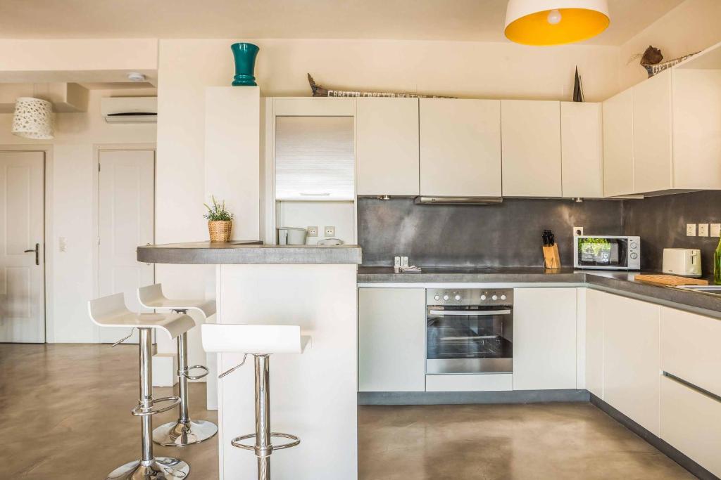 A kitchen or kitchenette at Kaminia Beach Villa