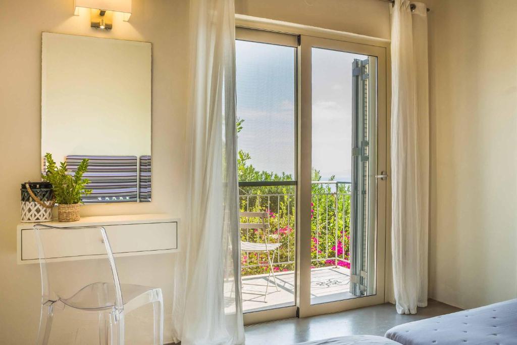 A balcony or terrace at Kaminia Beach Villa
