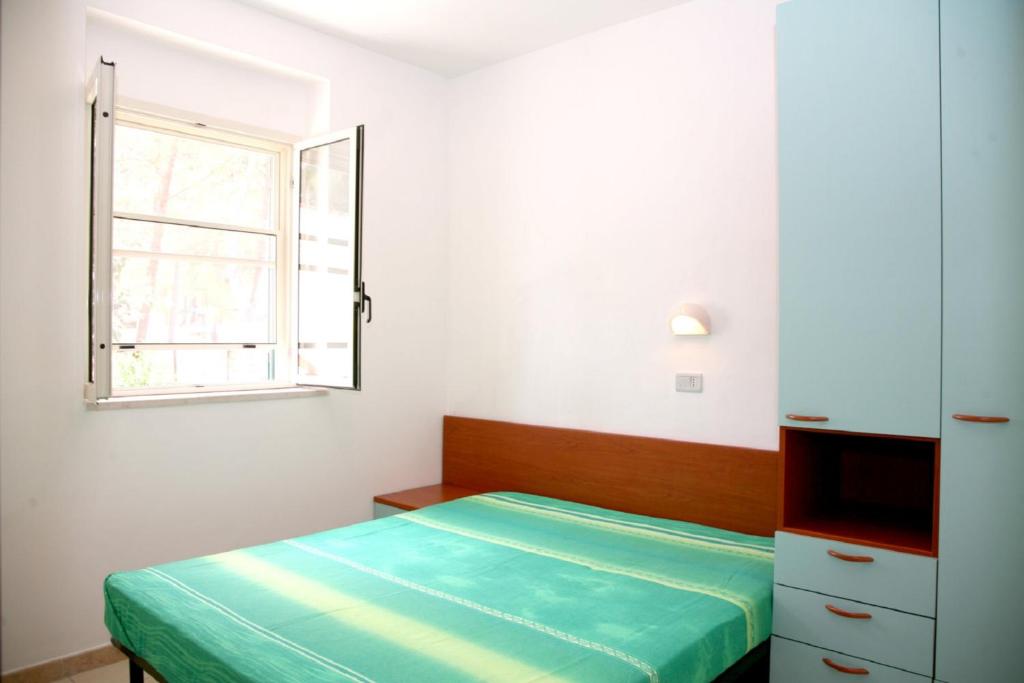 Postel nebo postele na pokoji v ubytování Camping La Gemma