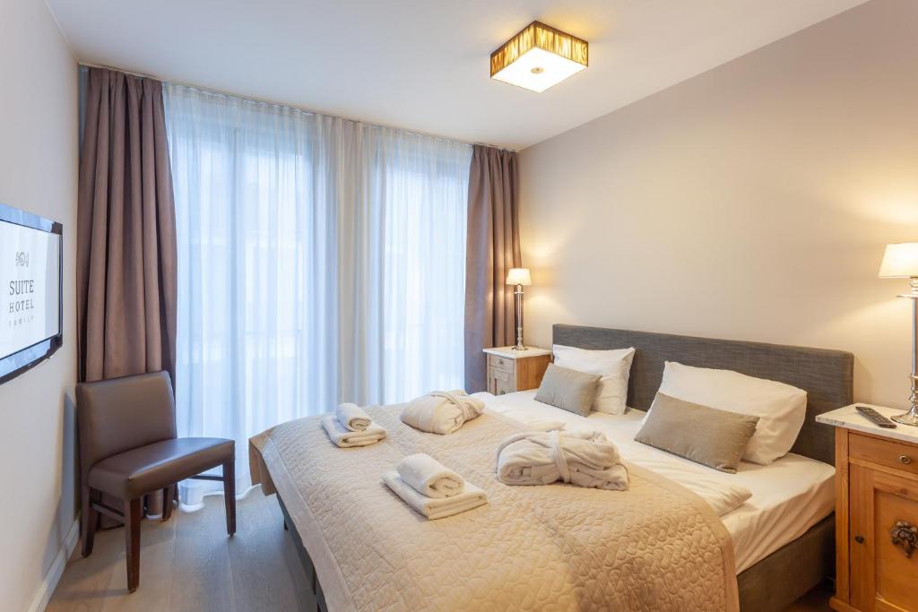 Postel nebo postele na pokoji v ubytování Suite Hotel Binz Familienhotel Rügen