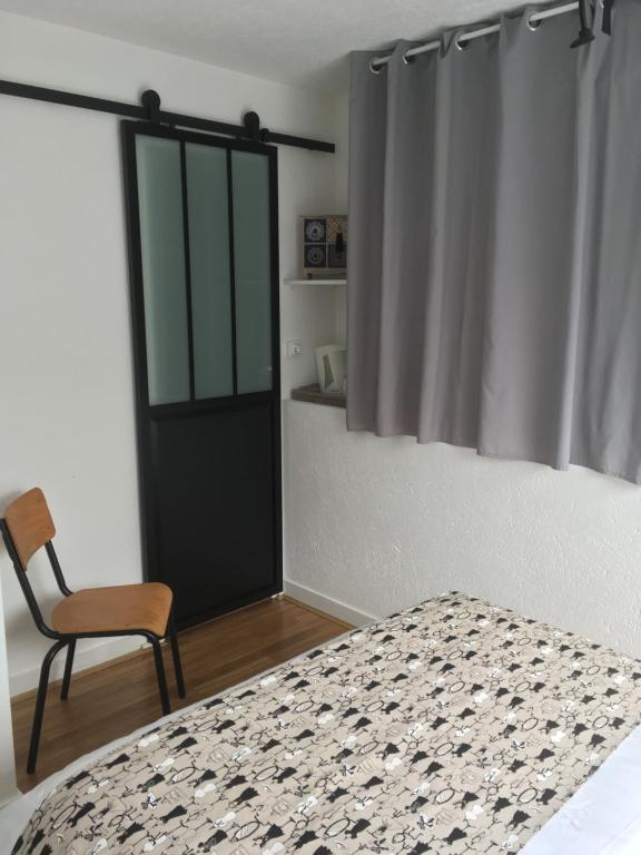 Postel nebo postele na pokoji v ubytování Les Fermes de Kercadoret