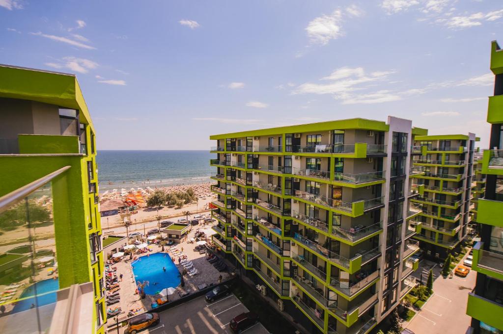an aerial view of a building and the beach at Cermar Apartment- Spa n Pool beach resort- parking in Mamaia