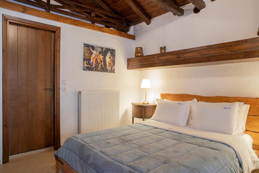 Postel nebo postele na pokoji v ubytování Guesthouse Ourania