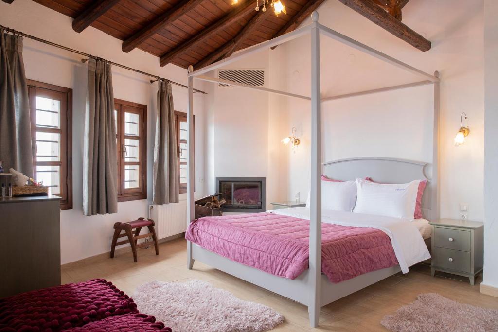 Postel nebo postele na pokoji v ubytování Guesthouse Ourania