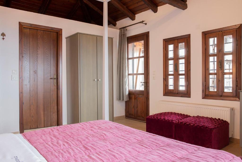 Postel nebo postele na pokoji v ubytování Guesthouse Ourania