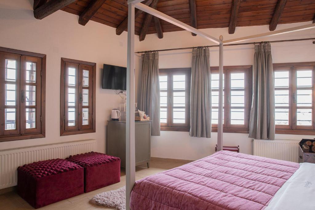 Postel nebo postele na pokoji v ubytování Guesthouse Ourania