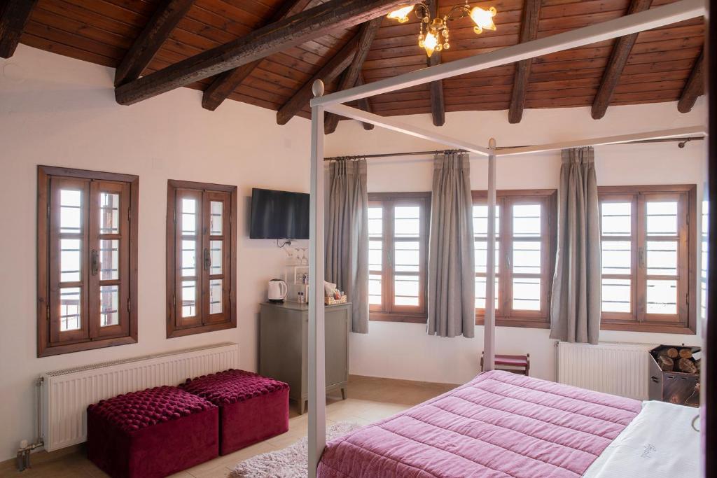Postel nebo postele na pokoji v ubytování Guesthouse Ourania