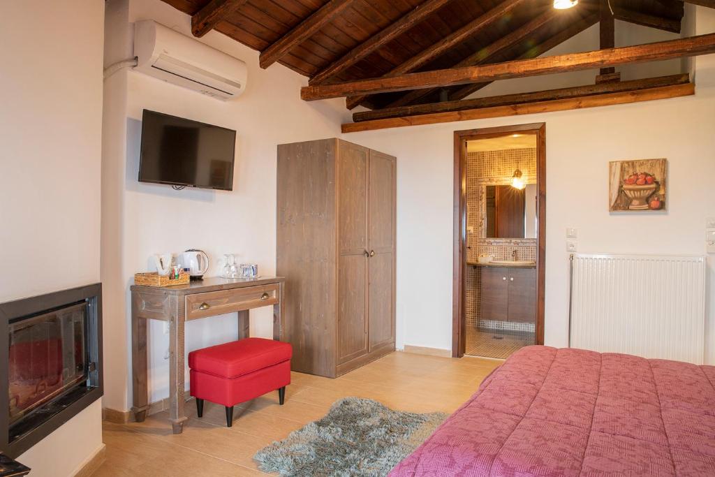 TV a/nebo společenská místnost v ubytování Guesthouse Ourania