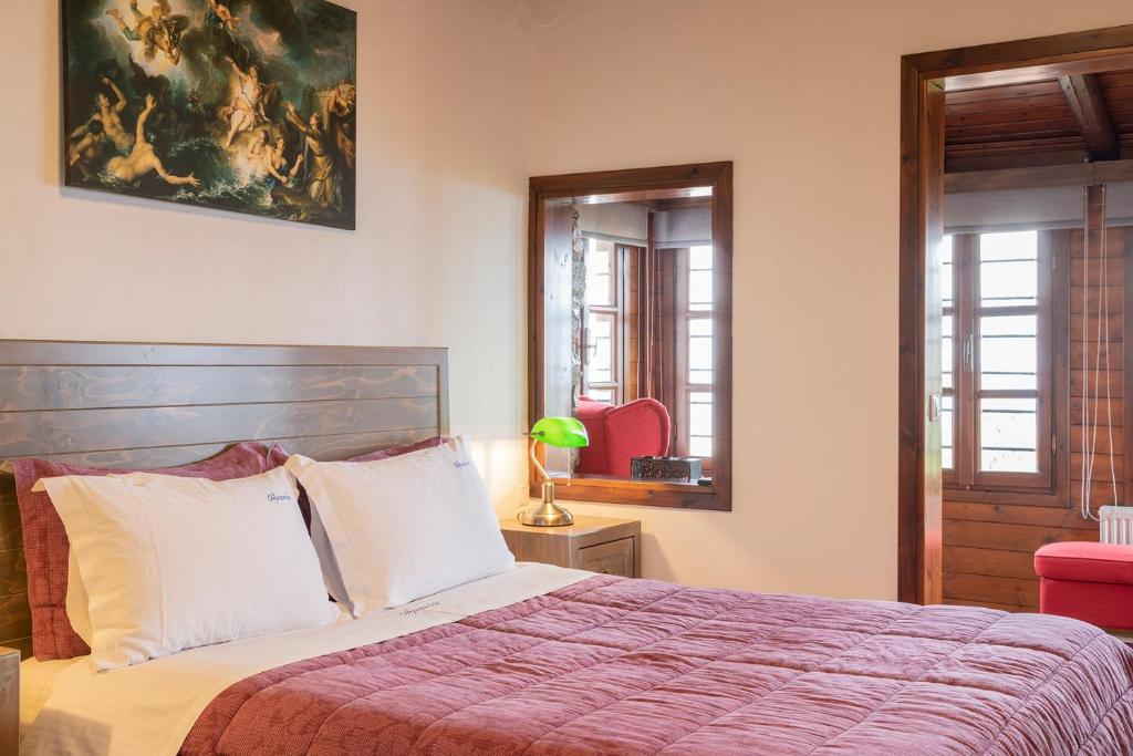 Postel nebo postele na pokoji v ubytování Guesthouse Ourania