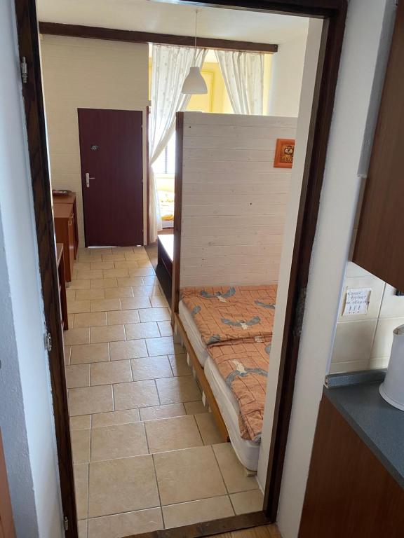 Postel nebo postele na pokoji v ubytování Apartmán Pod Hradem
