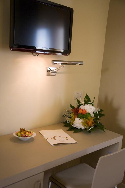 TV a/nebo společenská místnost v ubytování San Francesco Hotel