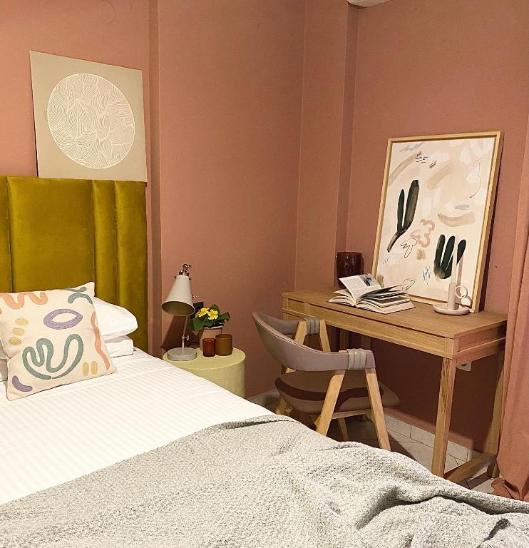 Postel nebo postele na pokoji v ubytování Agrinio ART Suites