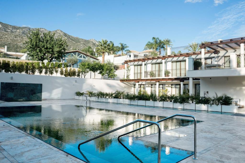 a swimming pool in the middle of a building at Sierra Blanca Resort and Spa in Marbella