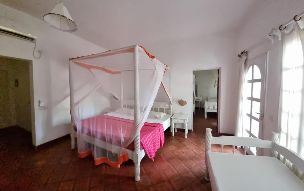 Postel nebo postele na pokoji v ubytování Lily Palm Resort
