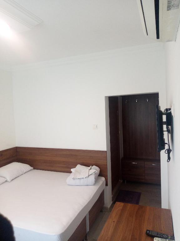 Postel nebo postele na pokoji v ubytování GÜVEN HOTEL