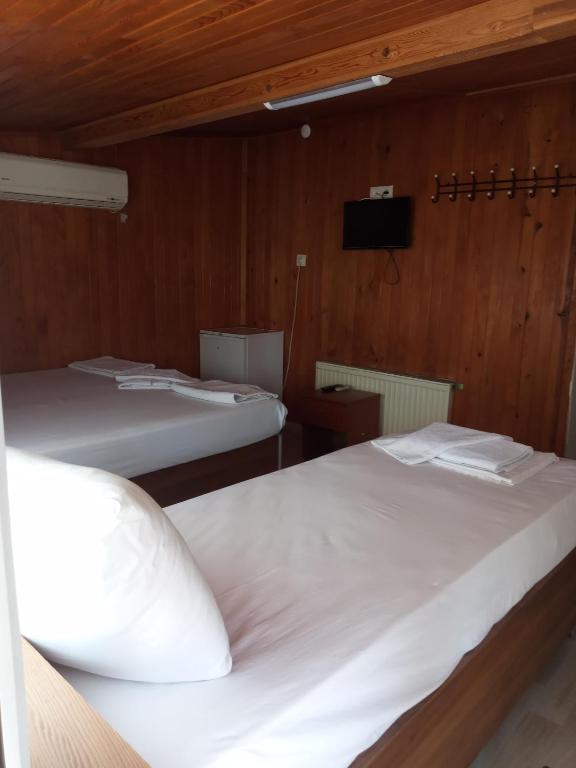 Postel nebo postele na pokoji v ubytování GÜVEN HOTEL
