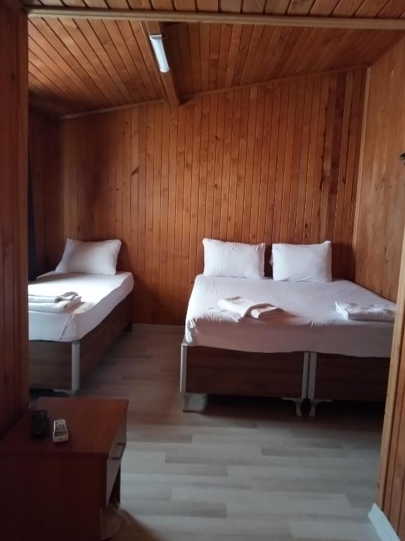 Postel nebo postele na pokoji v ubytování GÜVEN HOTEL