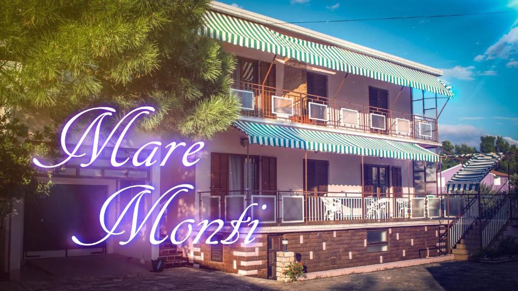 a building with a sign that says marry most at Apartments and Rooms Mare-Monti in Starigrad