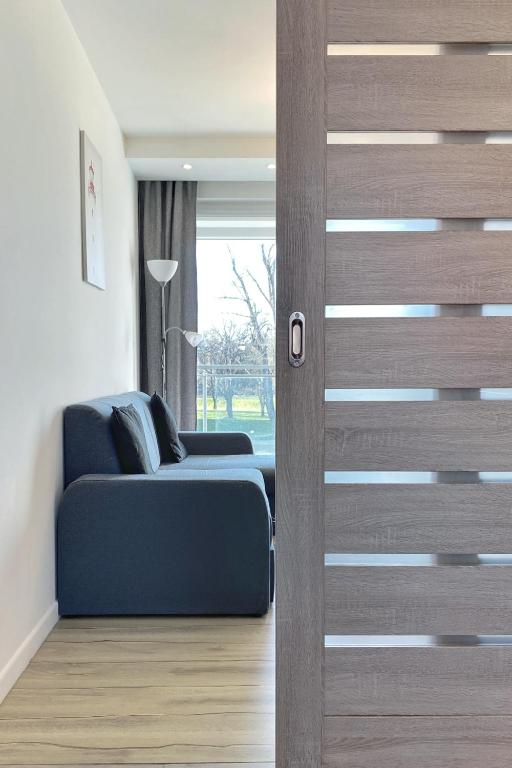 Posedenie v ubytovaní Capital Towers - Apartament Green z widokiem na rzekę