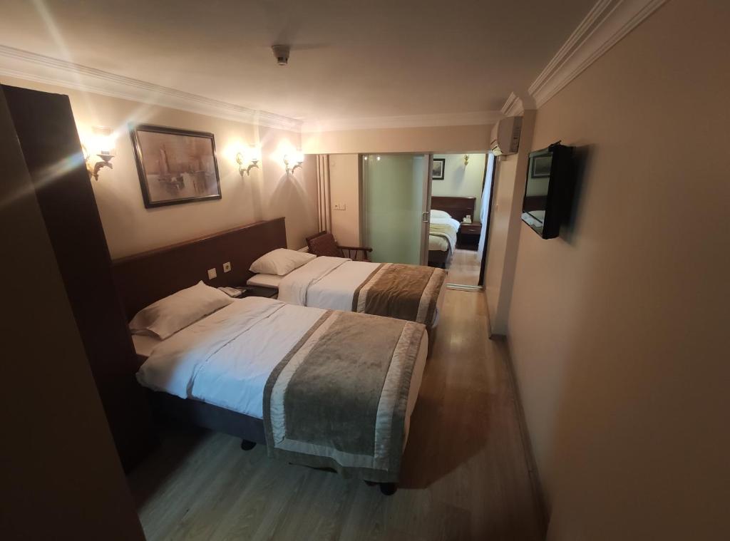 Postel nebo postele na pokoji v ubytování Hotel Akyildiz