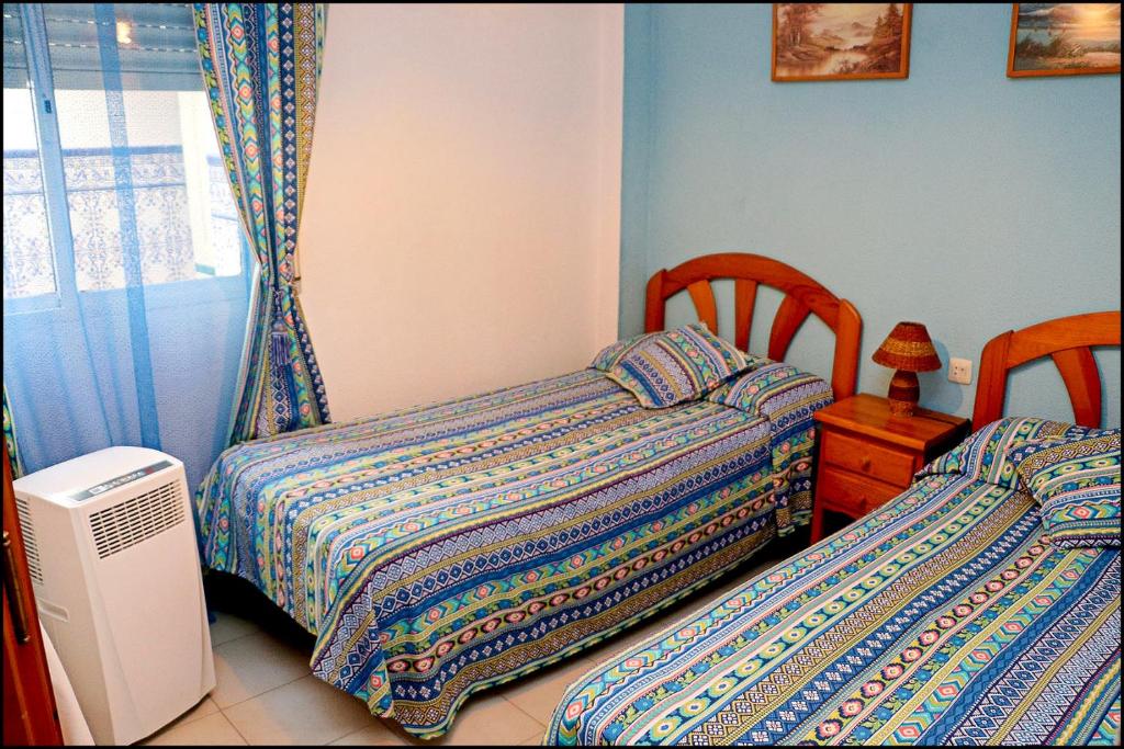 Postel nebo postele na pokoji v ubytování Apartamento El Carmen