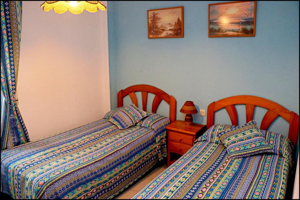 Postel nebo postele na pokoji v ubytování Apartamento El Carmen