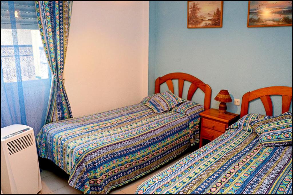 Postel nebo postele na pokoji v ubytování Apartamento El Carmen
