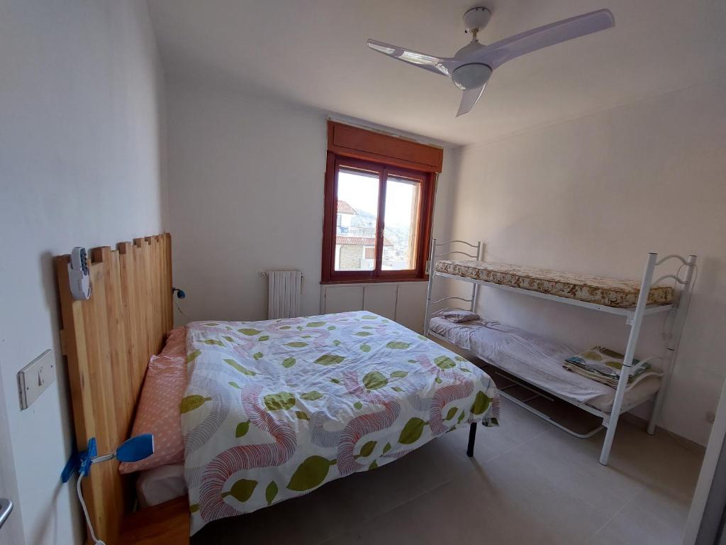 A bed or beds in a room at Una terrazza sul mare