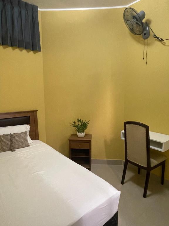 Rúm í herbergi á Hotel Calmelia