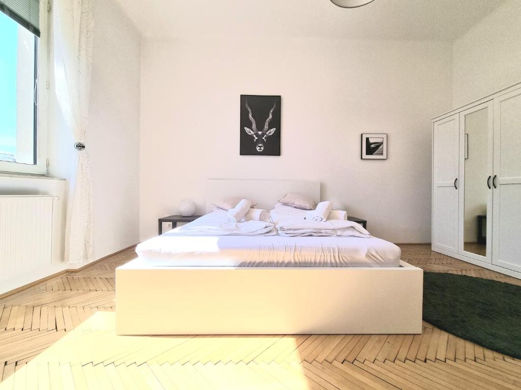 Uma cama ou camas num quarto em Vienna Experience
