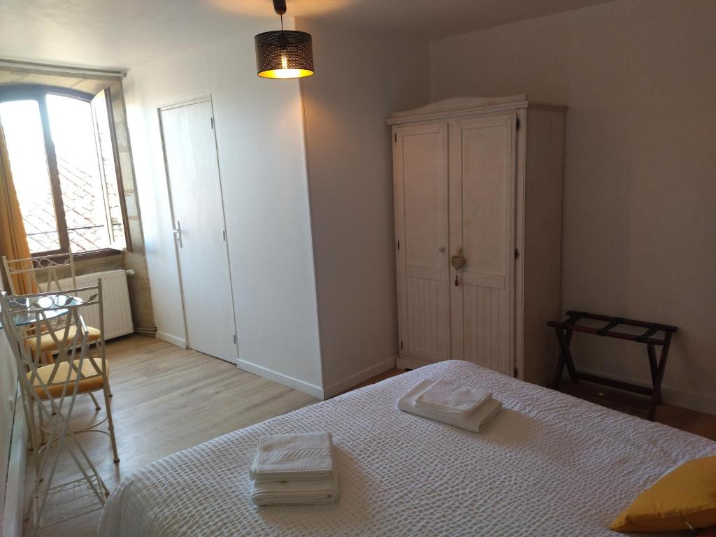 Postel nebo postele na pokoji v ubytování Le Pressoir chambres d'hôtes