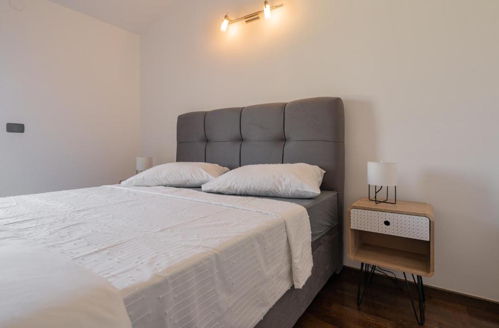 Postel nebo postele na pokoji v ubytování Penthouse Gea