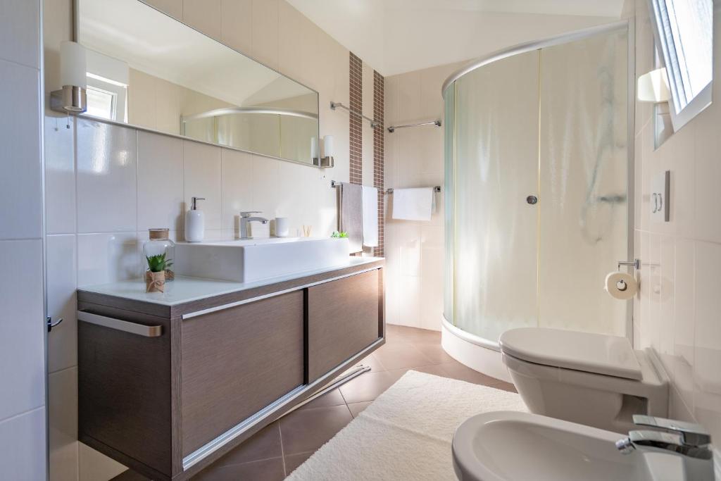Koupelna v ubytování Penthouse Gea