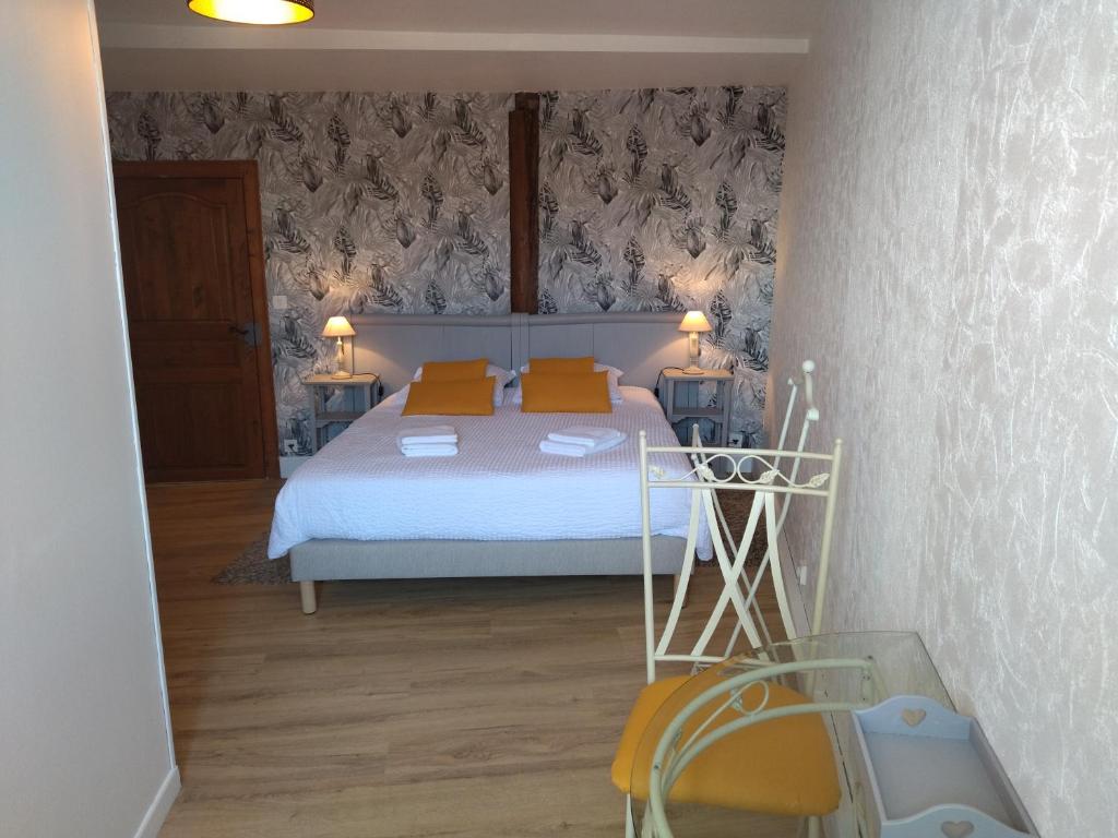 Postel nebo postele na pokoji v ubytování Le Pressoir chambres d'hôtes