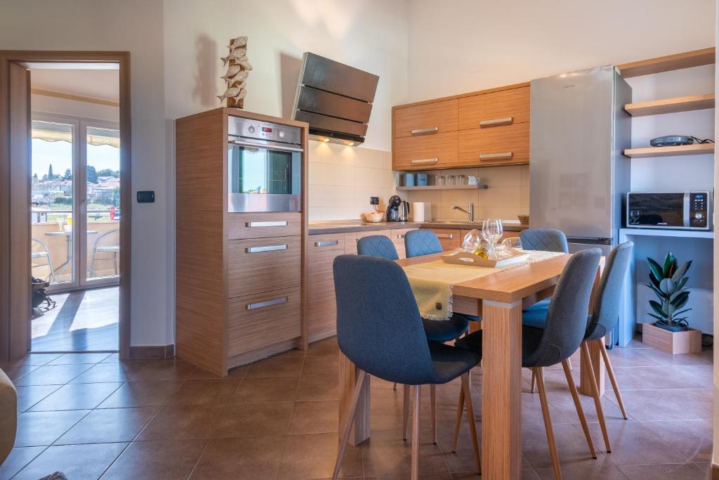 Kuchyň nebo kuchyňský kout v ubytování Penthouse Gea