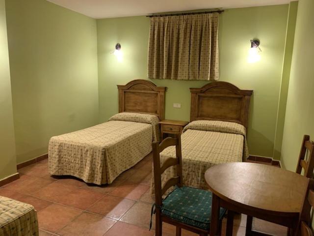 Postel nebo postele na pokoji v ubytování Hotel Langa